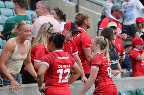 270626 - Barbarians v Wales Women - Jenna De Vera of Wales and Seren Lockwood of Wales speak to family, friends at supporters at the end of the match