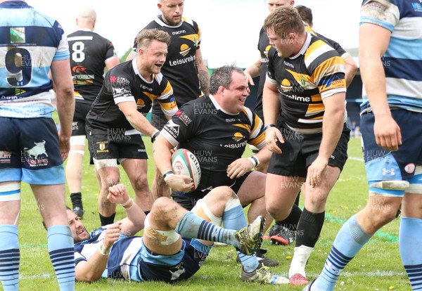 120518 - Bargoed v Merthyr, Principality Premiership - Nathan Trevett of Merthyr is congratulated by team mates after scoring try