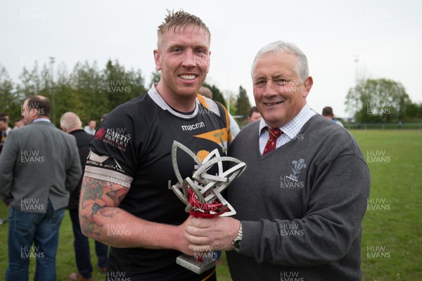120518 - Bargoed v Merthyr, Principality Premiership - Merthyr captain Craig Locke receives the Principality Premiership trophy from WRU Board member Anthony Buchanan