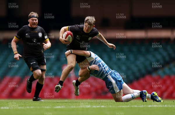 240422 - WRU Championship Cup Final � Bargoed v Neath - Elis Horgan of Neath is tackled by Rhys Thomas of Bargoed
