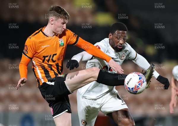 121223 - Barnet FC v Newport County - FA Cup Second Round Replay - Omar Bogle of Newport County is tackled by Finley Potter of Barnet 