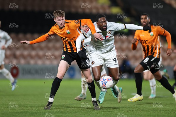 121223 - Barnet FC v Newport County - FA Cup Second Round Replay - Omar Bogle of Newport County is tackled by Finley Potter of Barnet 