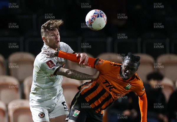 121223 - Barnet FC v Newport County - FA Cup Second Round Replay - James Clarke of Newport County is challenged by Idris Kanu of Barnet 