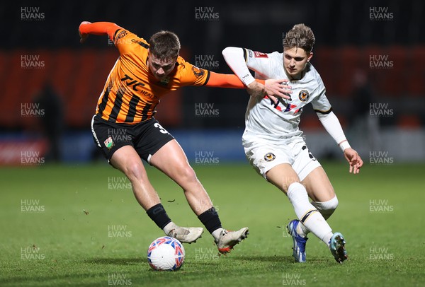 121223 - Barnet FC v Newport County - FA Cup Second Round Replay - Zak Brunt of Barnet is challenged by Lewis Payne of Newport County 