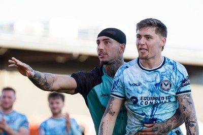 140326 - Barnet v Newport County - Sky Bet League 2 - Courtney Baker-Richardson of Newport County and James Crole of Newport County celebrate after the match
