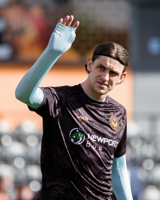 140326 - Barnet v Newport County - Sky Bet League 2 - Harrison Biggins of Newport County warming up