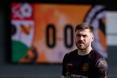 140326 - Barnet v Newport County - Sky Bet League 2 - Shaun MacDonald of Newport County warming up