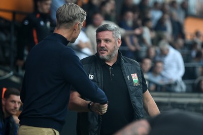 290725 - Barnet v Newport County - Carabao Cup Preliminary Round - Newport County Manager, David Hughes and Dean Brennan, Barnet Manager at the start of the game