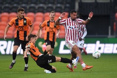 290725 - Barnet v Newport County - Carabao Cup Preliminary Round - Courtney Baker-Richardson of Newport County is challenged by Adam Senior of Barnet
