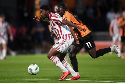 290725 - Barnet v Newport County - Carabao Cup Preliminary Round - Bobby Kamwa of Newport County is challenged by Idris Kanu of Barnet