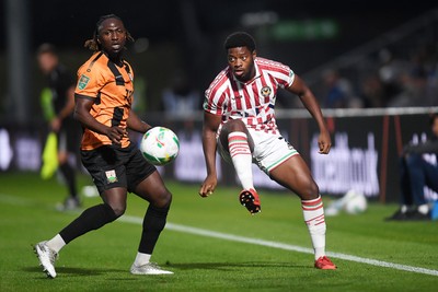 290725 - Barnet v Newport County - Carabao Cup Preliminary Round - Bobby Kamwa of Newport County is challenged by Idris Kanu of Barnet