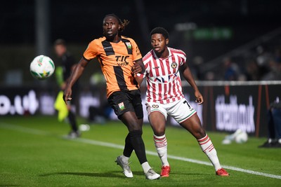 290725 - Barnet v Newport County - Carabao Cup Preliminary Round - Bobby Kamwa of Newport County is challenged by Idris Kanu of Barnet