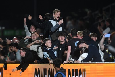 290725 - Barnet v Newport County - Carabao Cup Preliminary Round - Barnet fans celebrate after their side scores a late equaliser