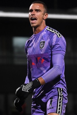 290725 - Barnet v Newport County - Carabao Cup Preliminary Round - Nik Tzanev of Newport County celebrates in front of the fans after saving a penalty