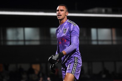 290725 - Barnet v Newport County - Carabao Cup Preliminary Round - Nik Tzanev of Newport County celebrates in front of the fans after saving a penalty
