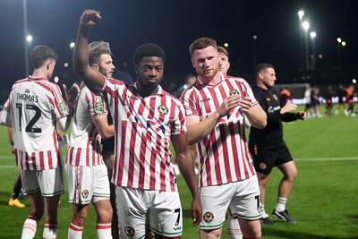 290725 - Barnet v Newport County - Carabao Cup Preliminary Round - Bobby Kamwa and Lee Jenkins of Newport County celebrates the win at full time
