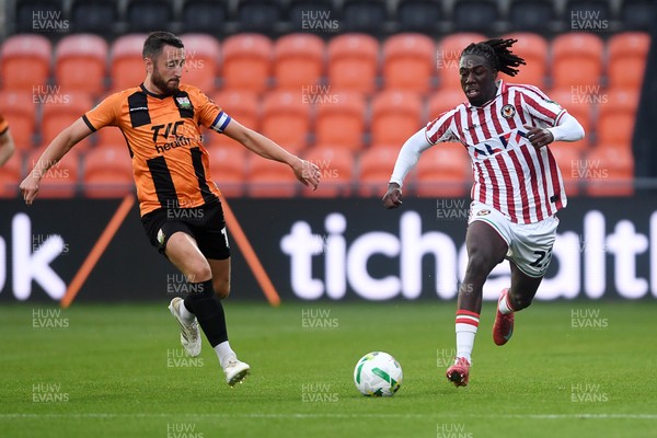 290725 - Barnet v Newport County - Carabao Cup Preliminary Round - Michael Reindorf of Newport County is challenged by Anthony Hartigan of Barnet