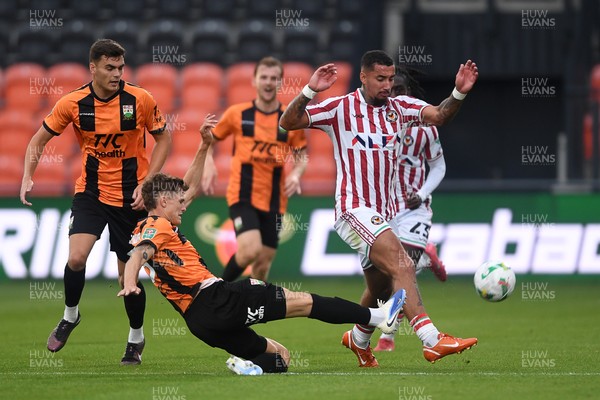 290725 - Barnet v Newport County - Carabao Cup Preliminary Round - Courtney Baker-Richardson of Newport County is challenged by Adam Senior of Barnet