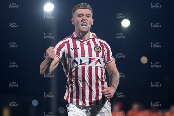 290725 - Barnet v Newport County - Carabao Cup Preliminary Round - Cameron Evans of Newport County scores the winning penalty and celebrates running towords the fans