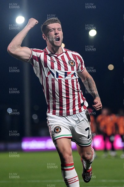 290725 - Barnet v Newport County - Carabao Cup Preliminary Round - Cameron Evans of Newport County scores the winning penalty and celebrates running towords the fans
