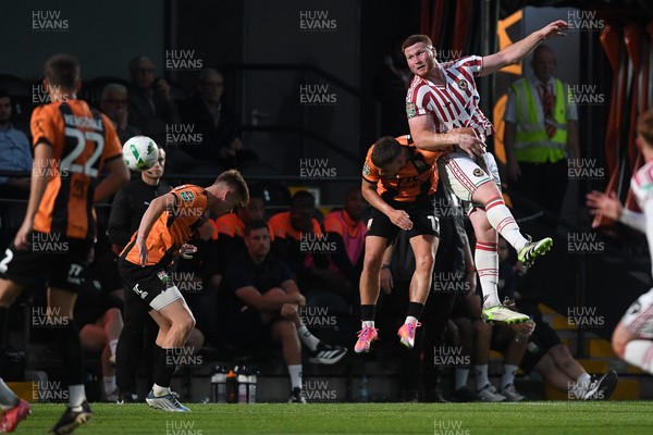 290725 - Barnet v Newport County - Carabao Cup Preliminary Round - Lee Jenkins of Newport County is challenged by Zak Brunt of Barnet