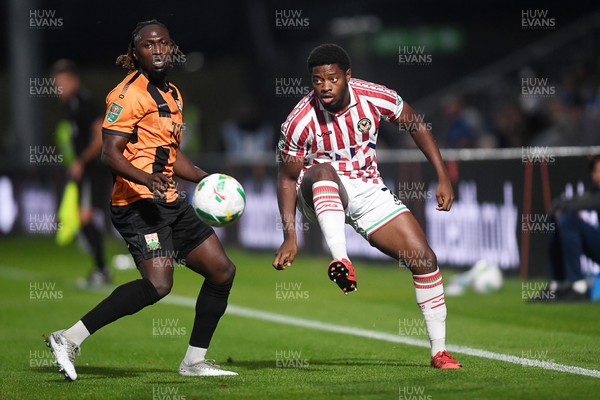 290725 - Barnet v Newport County - Carabao Cup Preliminary Round - Bobby Kamwa of Newport County is challenged by Idris Kanu of Barnet