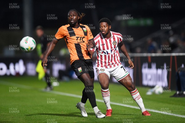 290725 - Barnet v Newport County - Carabao Cup Preliminary Round - Bobby Kamwa of Newport County is challenged by Idris Kanu of Barnet