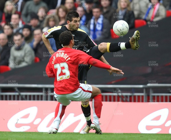 06.04.08 .. Barnsley v Cardiff City, FA Cup Semi-Final, Wembley Stadium -  Cardiff's Joe Ledley plays the ball over Barnsley's Marciano Van Homoet   