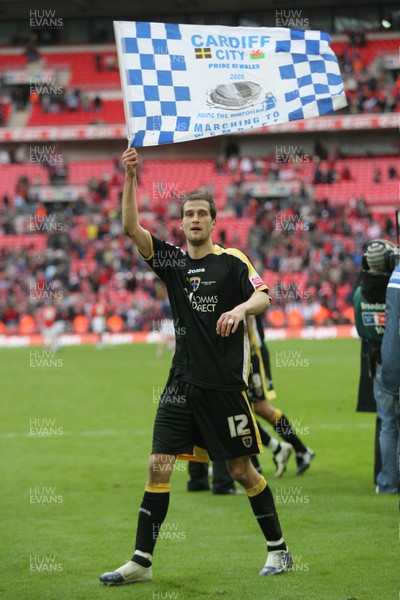 06.04.08 .. Barnsley v Cardiff City, FA Cup Semi-Final, Wembley Stadium -  Cardiff's Roger Johnson flies the flag at the end of the match 