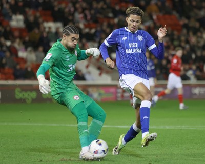 100326 - Barnsley v Cardiff City - Sky Bet League 1 - Goalkeeper Owen Goodman of Barnsley tries to block Omari Kellyman of Cardiff in Goalmouth