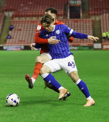 100326 - Barnsley v Cardiff City - Sky Bet League 1 - Cian Ashford of Cardiff and Corey O'Keeffe of Barnsley