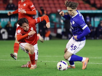 100326 - Barnsley v Cardiff City - Sky Bet League 1 - Cian Ashford of Cardiff and Mael de Gevigney of Barnsley