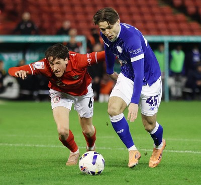 100326 - Barnsley v Cardiff City - Sky Bet League 1 - Cian Ashford of Cardiff and Mael de Gevigney of Barnsley