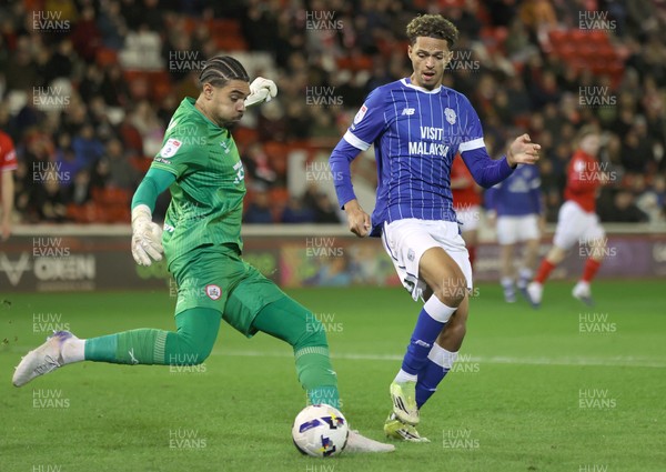 100326 - Barnsley v Cardiff City - Sky Bet League 1 - Goalkeeper Owen Goodman of Barnsley tries to block Omari Kellyman of Cardiff in Goalmouth