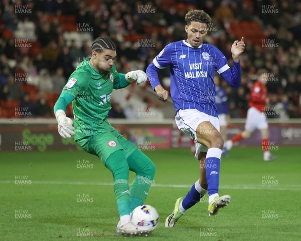 100326 - Barnsley v Cardiff City - Sky Bet League 1 - Goalkeeper Owen Goodman of Barnsley tries to block Omari Kellyman of Cardiff in Goalmouth