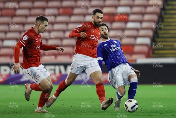 100326 - Barnsley v Cardiff City - Sky Bet League 1 - Calum Chambers of Cardiff pulled back by Adam Phillips of Barnsley and Jonathan Bland of Barnsley