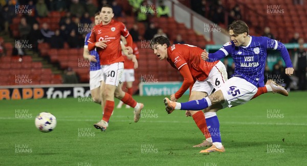 100326 - Barnsley v Cardiff City - Sky Bet League 1 - Cian Ashford of Cardiff takes a shot with Mael de Gevigney of Barnsley