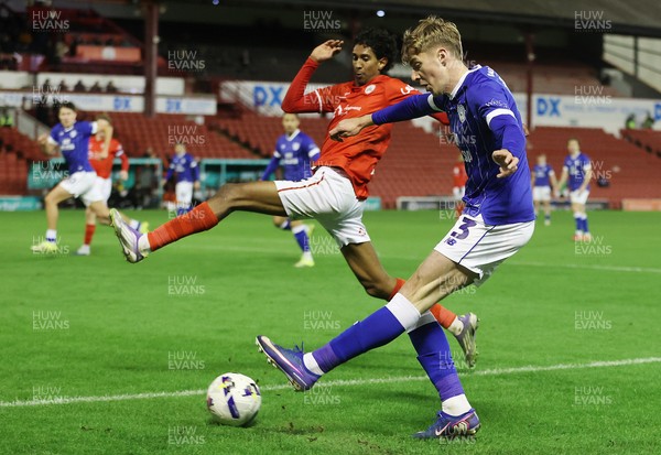 100326 - Barnsley v Cardiff City - Sky Bet League 1 - Joel Bagan of Cardiff takes a shot but thrown by Vimal Yoganathan of Barnsley