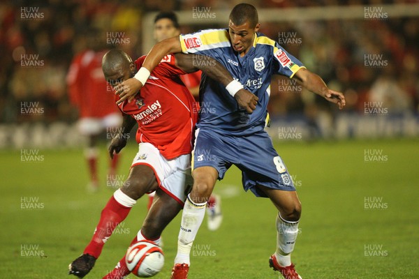 16.09.08 ... Barnsley v Cardiff City, Coca Cola Championship. - Cardiff's Jay Bothroyd and Barnsley's Darren Moore battle for the ball 