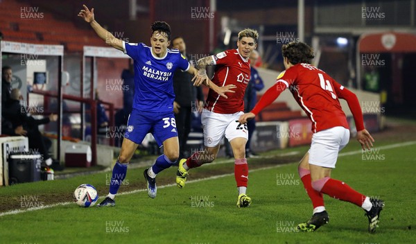 270121 - Barnsley v Cardiff City - Sky Bet Championship - Perry Ng of Cardiff and Dominik Frieser of Barnsley