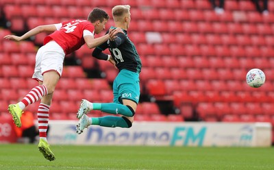 191019 - Barnsley v Swansea City - Sky Bet Championship - Aapo Halme of Barnsley takes out Sam Surridge of Swansea