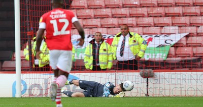 191019 - Barnsley v Swansea City - Sky Bet Championship - Freddie Woodman of Swansea makes a save from Dimitri Cavare of Barnsley