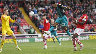 191019 - Barnsley v Swansea City - Sky Bet Championship - Andre Ayew of Swansea heads in the 1st goal of the match past Brad Collins of Barnsley