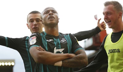 191019 - Barnsley v Swansea City - Sky Bet Championship - Andre Ayew of Swansea celebrates scoring the 1st goal of the match with Besant Celina