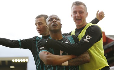 191019 - Barnsley v Swansea City - Sky Bet Championship - Andre Ayew of Swansea celebrates scoring the 1st goal of the match with Besant Celina