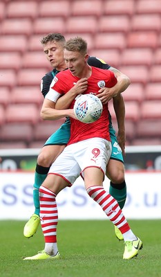 191019 - Barnsley v Swansea City - Sky Bet Championship - Cauley Woodrow of Barnsley and Jake Bidwell of Swansea