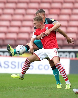 191019 - Barnsley v Swansea City - Sky Bet Championship - Cauley Woodrow of Barnsley and Jake Bidwell of Swansea