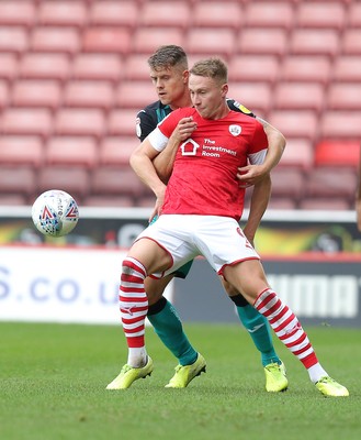 191019 - Barnsley v Swansea City - Sky Bet Championship - Cauley Woodrow of Barnsley and Jake Bidwell of Swansea