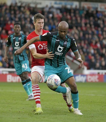 191019 - Barnsley v Swansea City - Sky Bet Championship - Aapo Halme of Barnsley holds back Andre Ayew of Swansea in the goalmouth