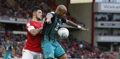 191019 - Barnsley v Swansea City - Sky Bet Championship - Andre Ayew of Swansea and Alex Mowatt of Barnsley